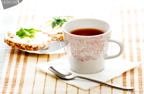 Image of diet breakfast with tea and corn bread