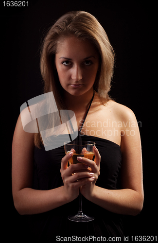 Image of beautiful girl with glass of wine