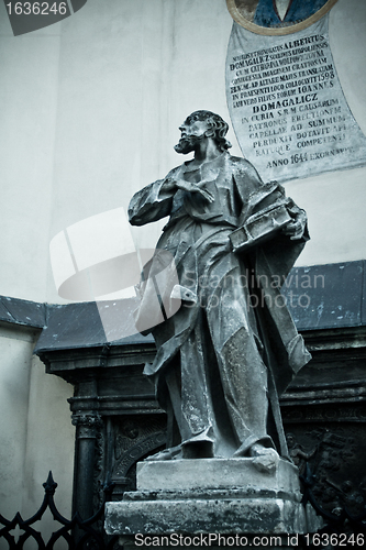Image of statue with book near Latin Cathedral