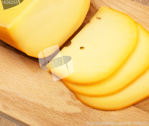 Image of cheese slices on cutting board