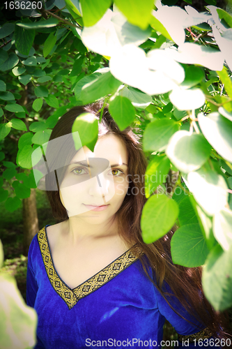 Image of beautiful princess standing in shadow