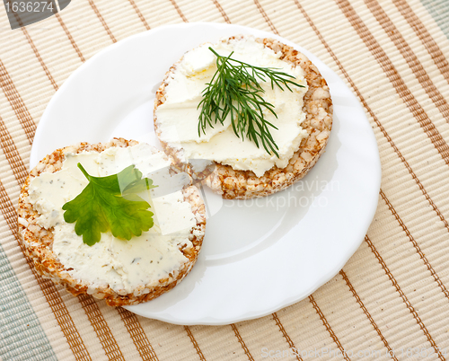 Image of two corn bread on white dish