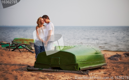 Image of couple embrace on a beach