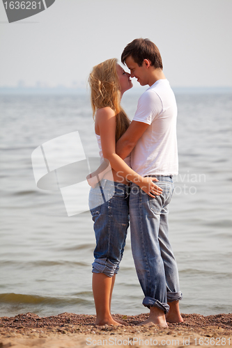 Image of young couple on beach