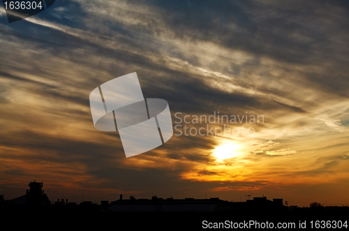 Image of sunset above town