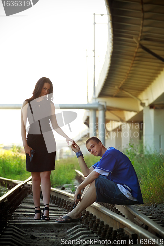 Image of couple on rails