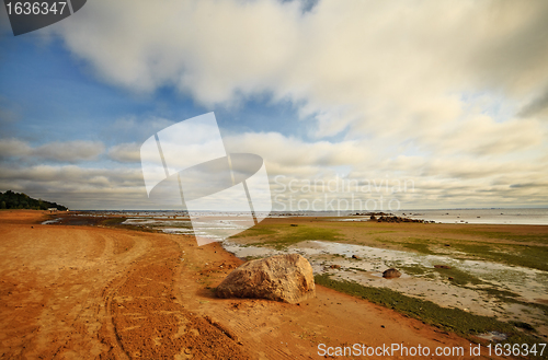 Image of seashore with big stone