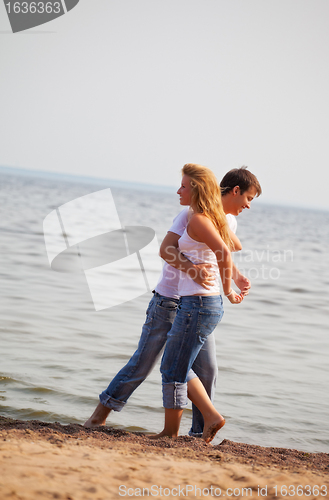 Image of couple fun on a beach