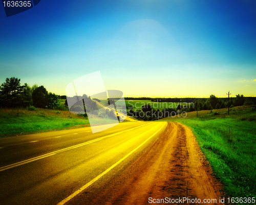 Image of highway under blue sky