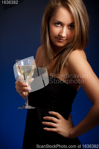 Image of beautiful girl with glass of wine