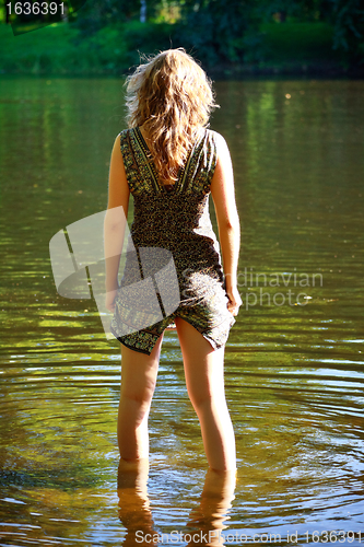 Image of girl stand in river