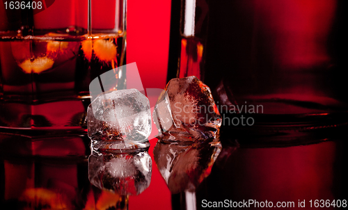 Image of two ice cube and whiskey