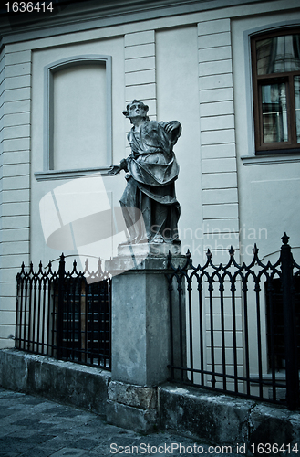 Image of statue with book