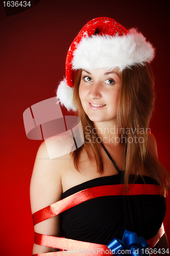 Image of smiling girl in santa hat