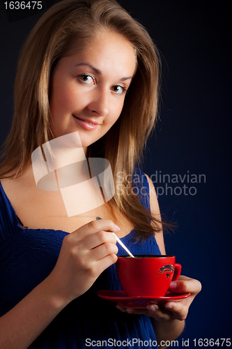 Image of beautiful girl with cup of coffee