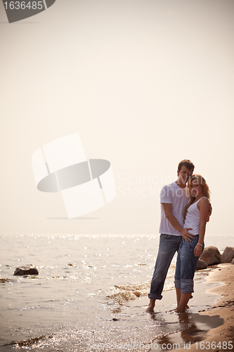 Image of beautiful couple on a seashore