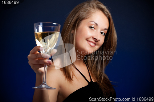 Image of beautiful girl with glass of wine