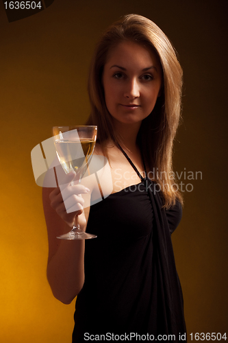 Image of beautiful girl with glass of wine