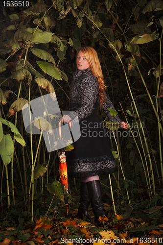 Image of  girl running in enchanted forest