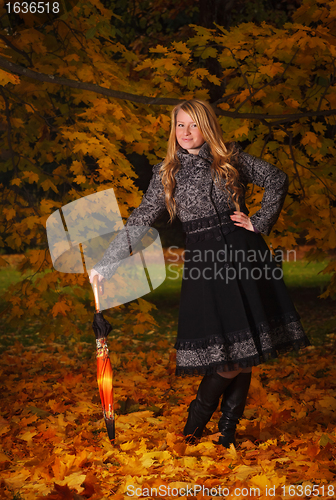 Image of beautiful girl in autumn forest