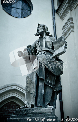 Image of statue with book