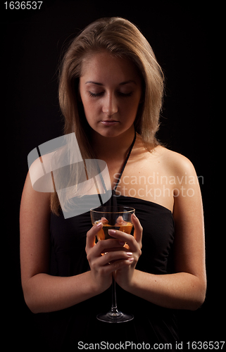 Image of beautiful girl with glass of wine