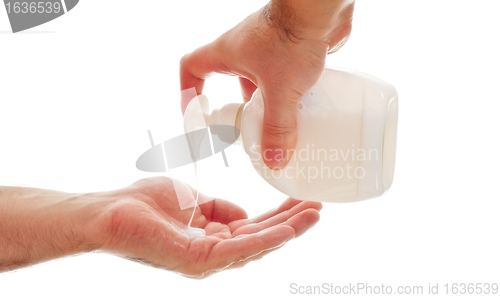 Image of washing hands with liquid soap