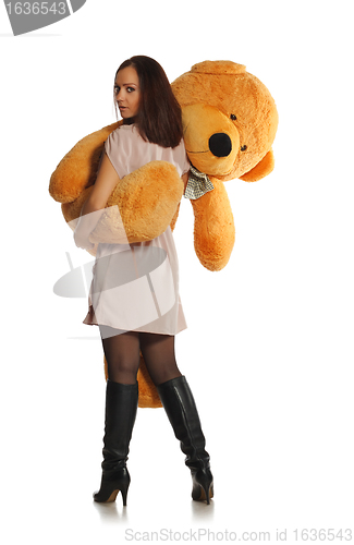 Image of beautiful girl with toy bear