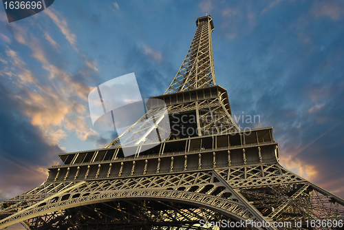 Image of Eiffel Tower at Sunset against a Cloudy Sky