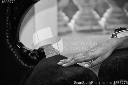 Image of Woman Hand Touching the Armchair