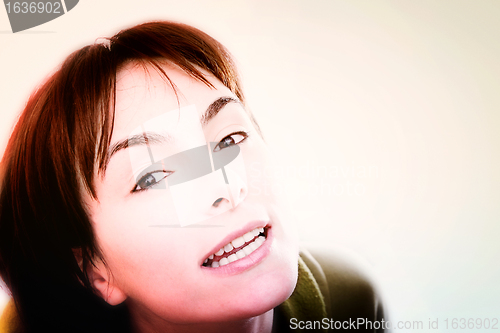 Image of Young woman in bed