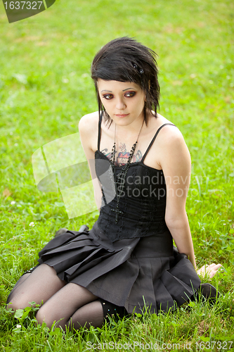 Image of girl in gothic style on grass