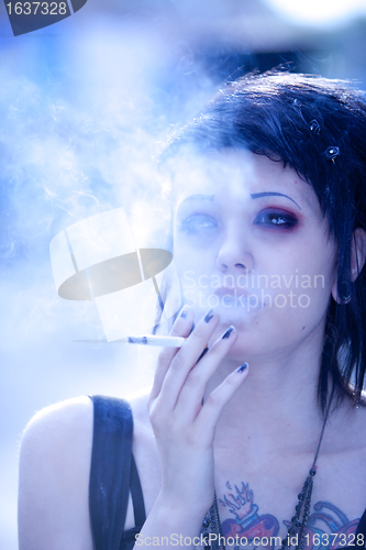 Image of smoking girl in gothic style