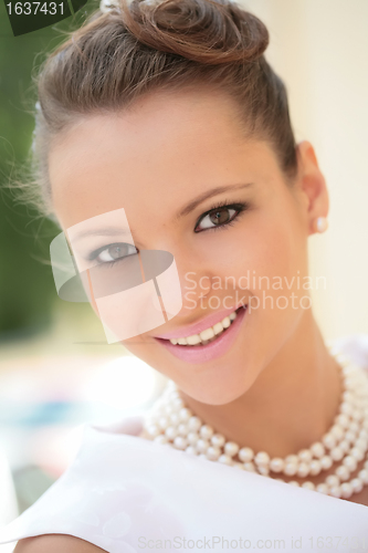 Image of girl with pearl necklace