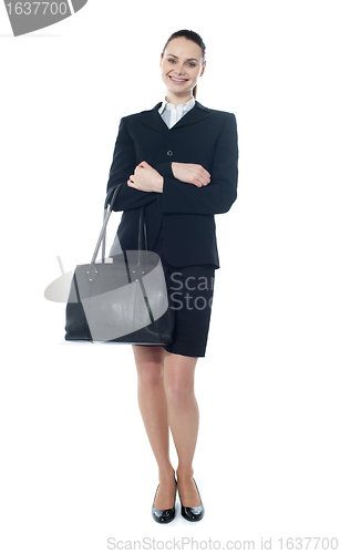 Image of Full length of businesswoman with handbag