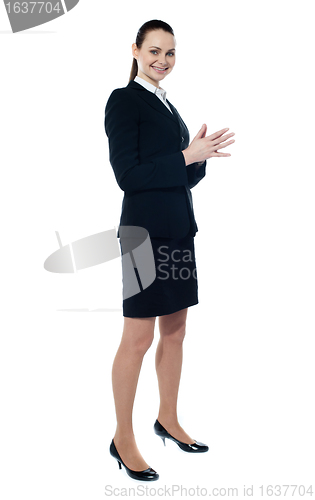 Image of Full length of corporate smiling woman