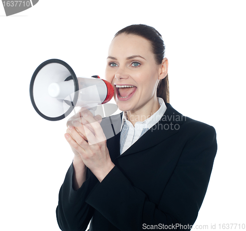 Image of Pretty lady giving instructions with megaphone