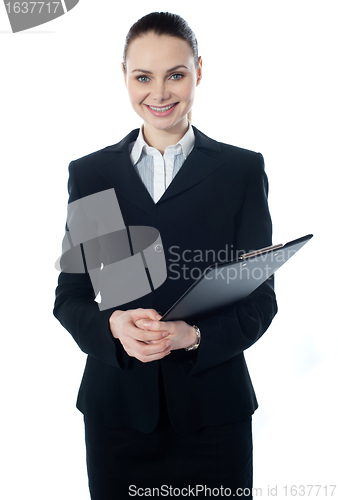 Image of Young businesswoman with folder
