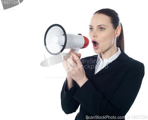 Image of Business woman giving instructions with megaphone