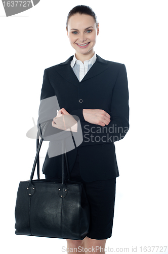 Image of Coporate lady holding a handbag
