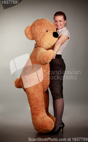 Image of girl dancing with toy bear