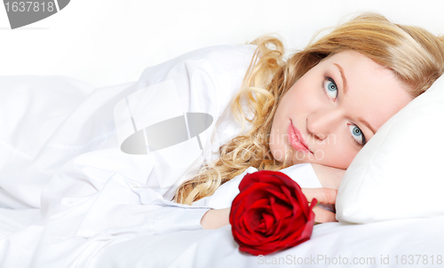 Image of Woman In Bed With Rose