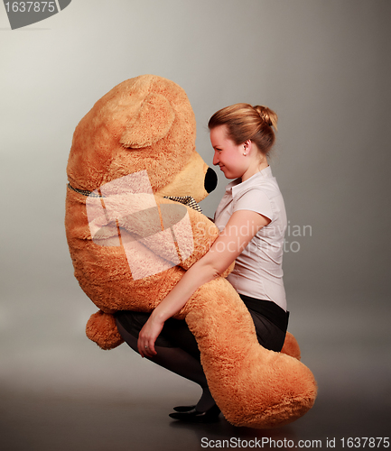 Image of girl with toy bear