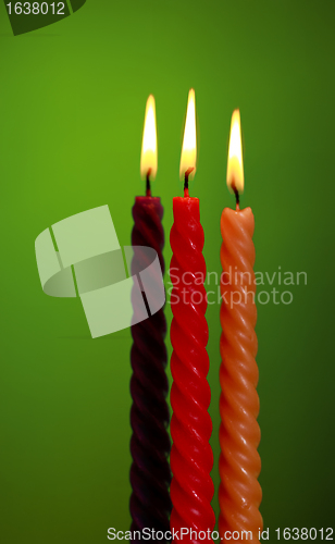 Image of Three Candles On Green