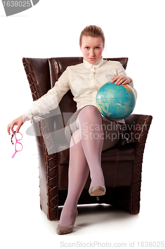 Image of strict teacher sitting in armchair