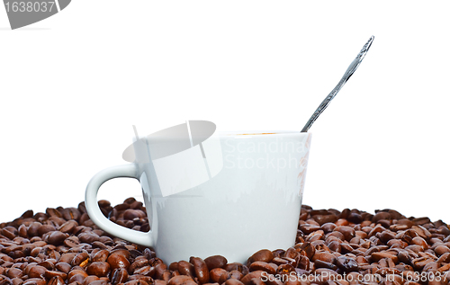 Image of espresso cup in coffee beans