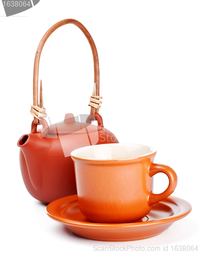 Image of clay kettle and cup with saucer