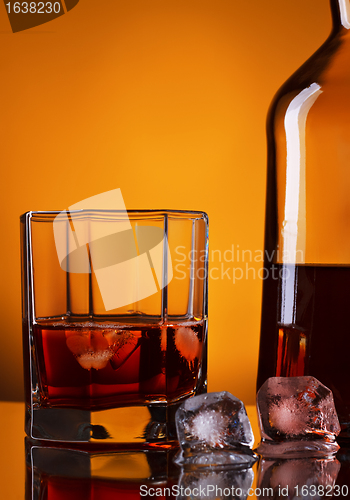 Image of Whiskey Bottle And Glass