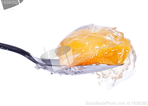 Image of mandarin in jelly on spoon