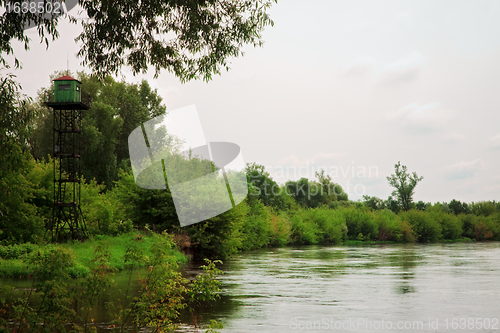 Image of calm river with watchtower